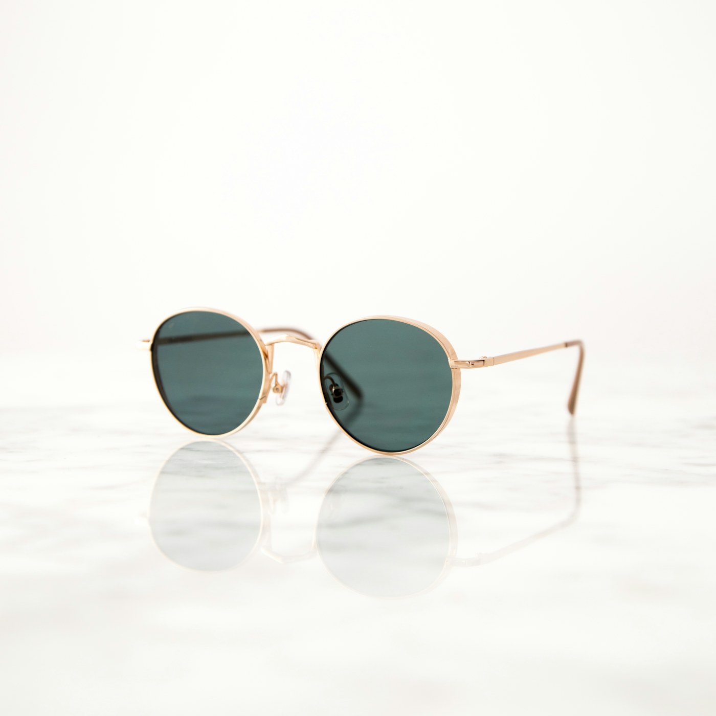 Black designer sunglasses on neutral surface