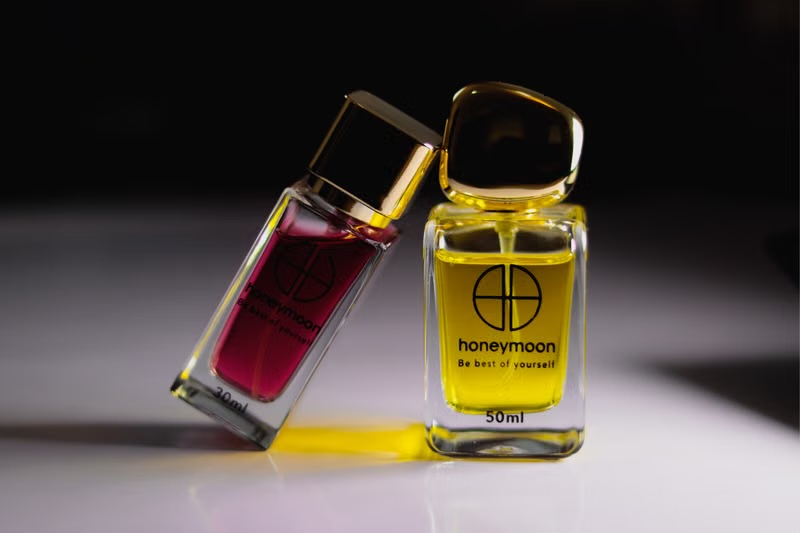 Perfume bottle closeup on plain tabletop